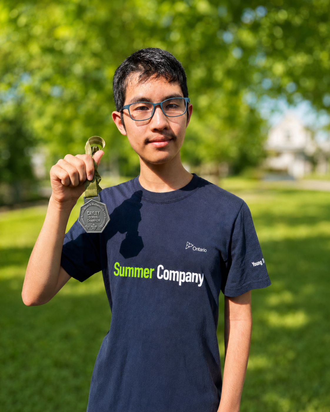 Casper Gu holding his Cayley Math Contest School Champion medal
